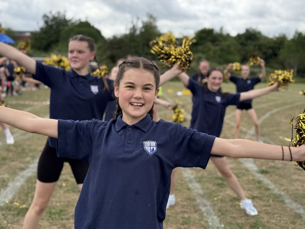 Cheerleaders on the sports pitch at Bishop Perowne School