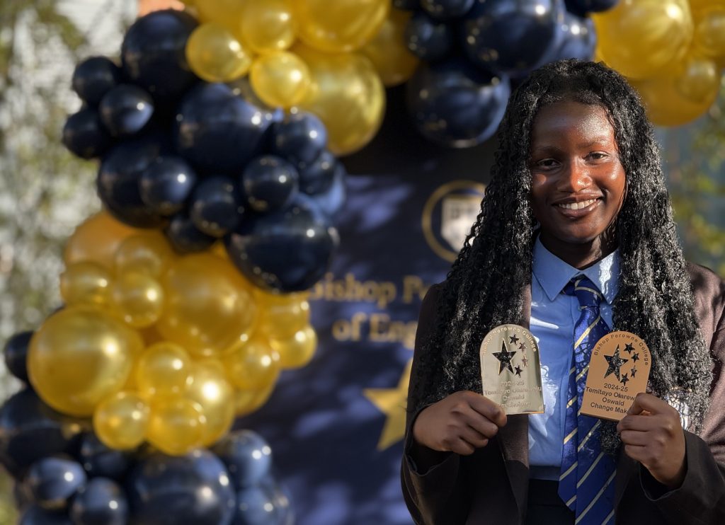 A smiling girl with balloons psychology at Bishop Perowne